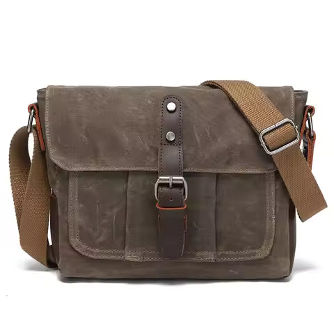 Sac bandoulière unisexe vintage en toile porté épaule