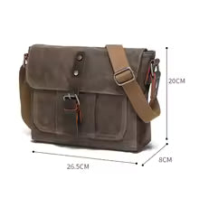 Sac bandoulière unisexe vintage en toile porté épaule